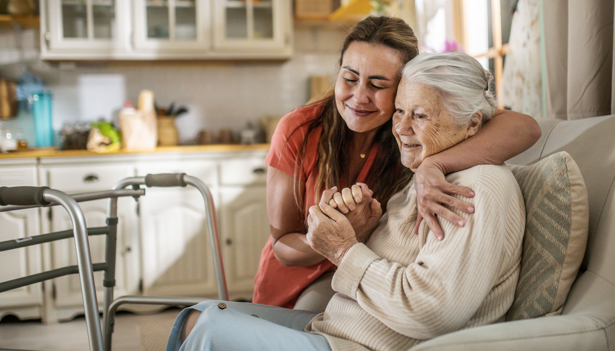 contact-us-background Daughter Assisting Senior Woman with Walker at home